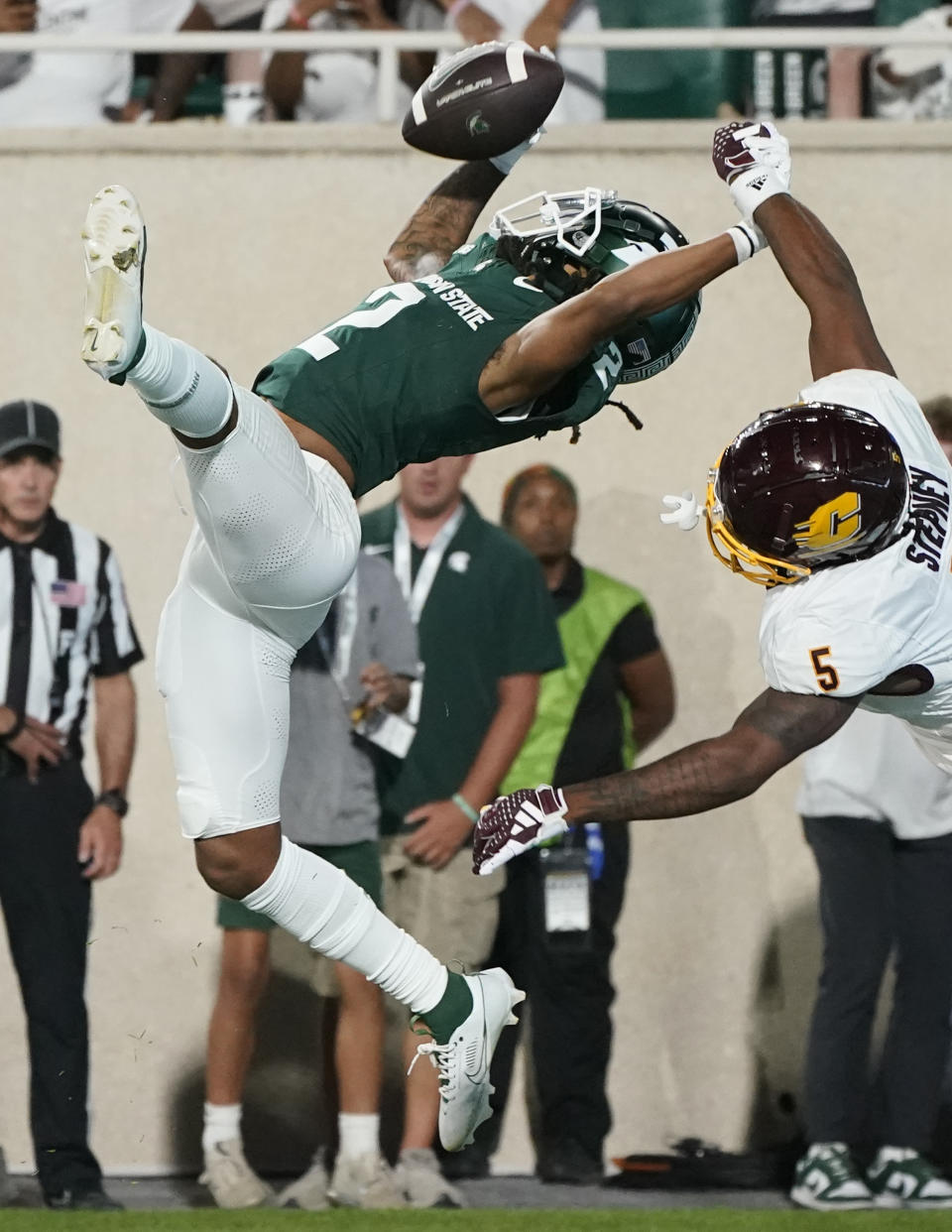 Michigan State wide receiver Tyrell Henry (2), defended by Central Michigan defensive back De'Javion Stepney (5), catches a 10-yard pass for a touchdown during the second half of an NCAA college football game, Friday, Sept. 1, 2023, in East Lansing, Mich. (AP Photo/Carlos Osorio)