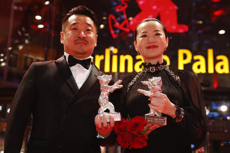 Actors Yong Mei and Wang Jingchun pose with Silver Bears for Best Actor and Actress, after the awards ceremony at the 69th Berlinale International Film Festival in Berlin, Germany, February 16, 2019. REUTERS/Fabrizio Bensch