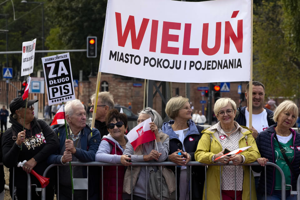 People show a banner reading "Wielun, City of Peace and Reconciliation" during a march to support the opposition against the governing populist Law and Justice party in Warsaw, Poland, Sunday, Oct. 1, 2023. Polish opposition leader Donald Tusk seeks to boost his election chances for the parliament elections on Oct. 15, 2023, leading the rally in the Polish capital. (AP Photo/Rafal Oleksiewicz)