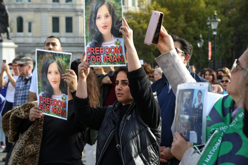 Iranian protesters call for justice for Mahsa Amini during a protest organized in London’s Trafalgar Square. <a href="https://www.gettyimages.com/detail/news-photo/iranian-protesters-hold-photographs-of-mahsa-amini-during-news-photo/1244373894?adppopup=true" rel="nofollow noopener" target="_blank" data-ylk="slk:Steve Taylor/SOPA Images/LightRocket via Getty Images;elm:context_link;itc:0;sec:content-canvas" class="link ">Steve Taylor/SOPA Images/LightRocket via Getty Images</a>