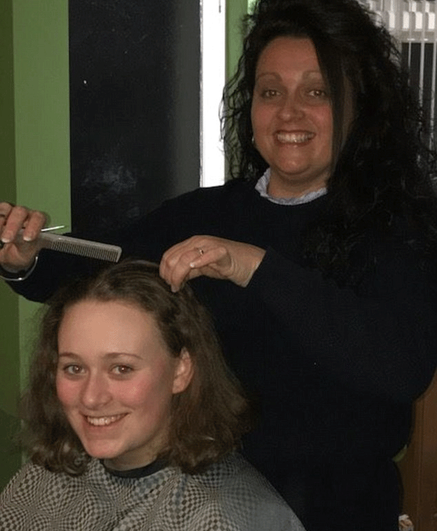 Chloe Wickham and her hairdresser. <i>(Photo via TheBrainTumourCharity.org)</i>