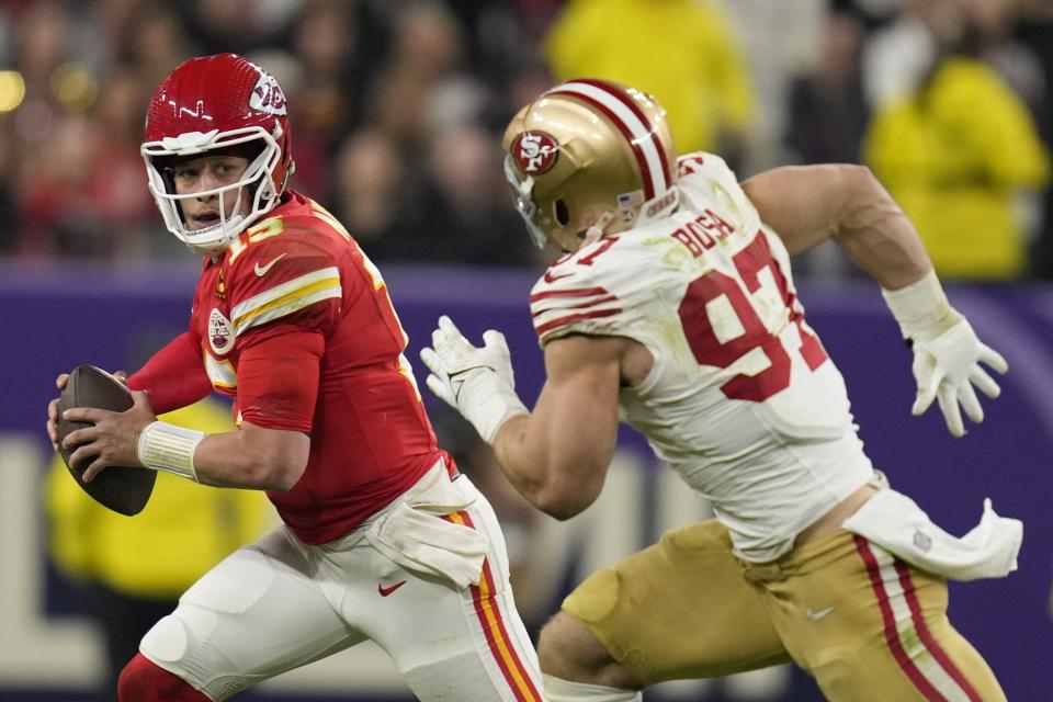 San Francisco 49ers defensive end Nick Bosa (97) chases Kansas City Chiefs quarterback Patrick Mahomes (15) during the second half of the NFL Super Bowl 58 football game Sunday, Feb. 11, 2024, in Las Vegas. (AP Photo/Ashley Landis)