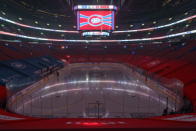 FILE - The clock at the Bell Centre shows graphics before the postponement of an NHL hockey game between the Montreal Canadiens and the Edmonton Oilers in Montreal, in this Monday, March 22, 2021, file photo. The iconic shrine where the Canadiens hoisted 12 of their 24 Cups has been turned into a multiplex theater. The Canadiens have since moved to the Bell Centre, which hosting its first Cup Final series. (Paul Chiasson/The Canadian Press via AP, File)