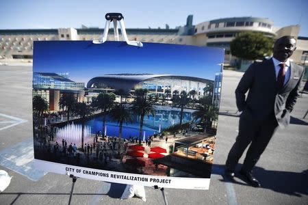 Hollywood Park project manager Gerard McCallum stands next to plans for development at the site of the former Hollywood Park Race Track at a news conference in Inglewood, Los Angeles, January 5, 2015. REUTERS/Lucy Nicholson