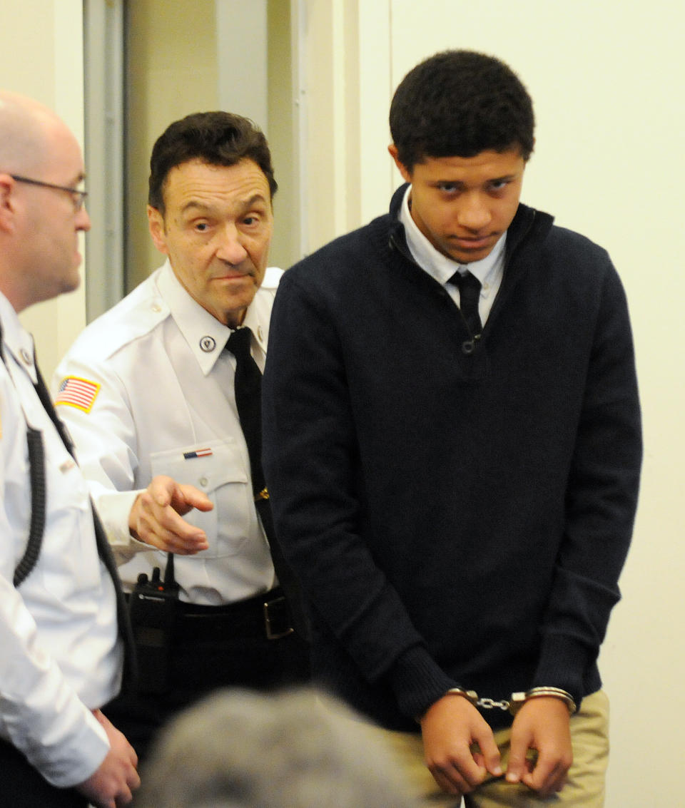 FILE - In this Dec. 4, 2013 file photo, Phillip Chism, 14, from Danvers, Mass., is lead into the court room at his arraignment in Salem Superior Court in Salem, Mass. Chism, accused of raping and killing Danvers High School teacher Colleen Ritzer in October, is returning to court Thursday, Jan. 30, 2014 for arraignment on a second rape charge. (AP Photo/The Eagle-Tribune, Paul Bilodeau, Pool, File)