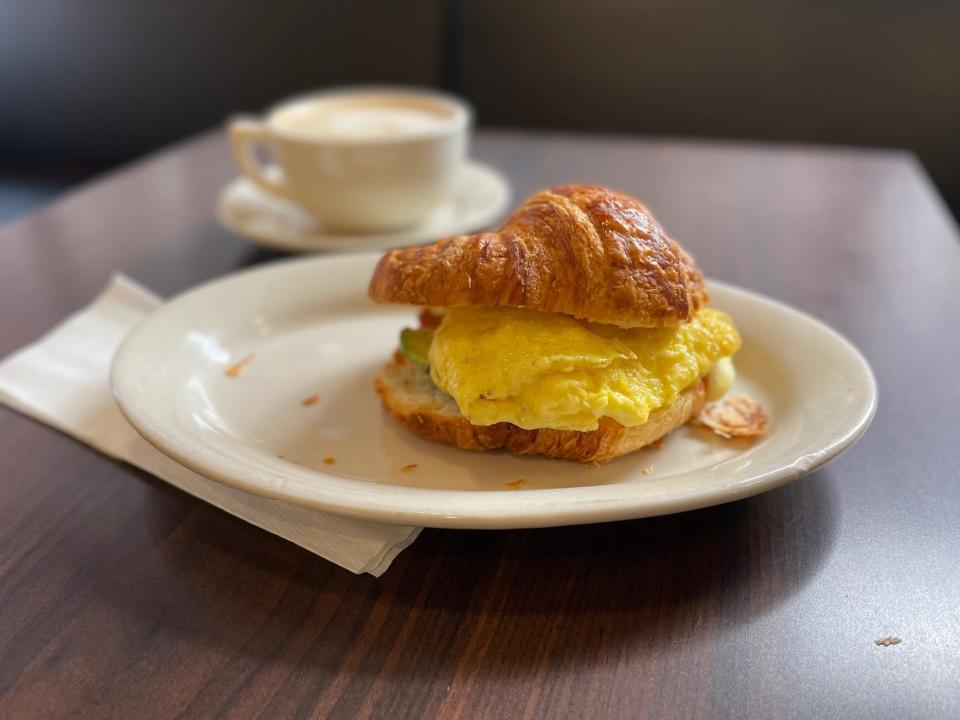 An avocado croissant breakfast sandwich and a caramel macchiato at La Mie Elevate on Feb. 8, 2022