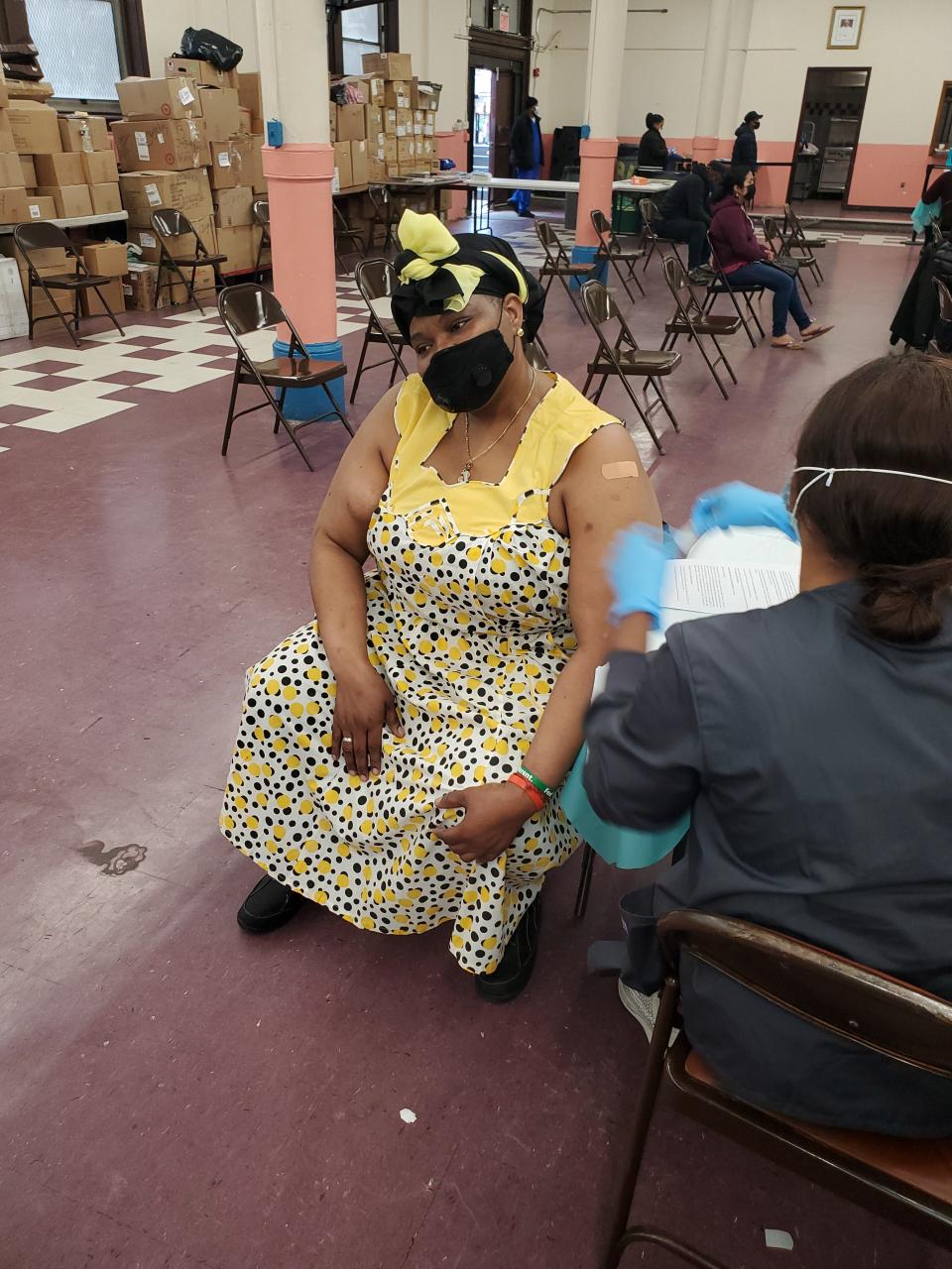 During a Bronx, New York vaccine event by Afro-Central American cultural center Casa Yurumein, a worker injects Ivett Suazo David, who is of the Afro-Indigenous ethnic group, the Garífuna of Central America.