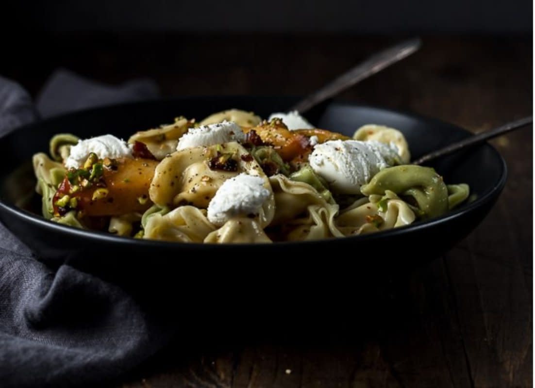 <p>Nothing screams summer dinner quite like this juicy pasta salad made with tortellini, fresh grilled summer peaches, crispy fried pancetta and a deliciously sweet and tart white balsamic vinaigrette.</p><p><strong>Get the recipe: <a href="https://www.wenthere8this.com/peach-tortellini-salad/" rel="nofollow noopener" target="_blank" data-ylk="slk:Peach Tortellini Salad;elm:context_link;itc:0;sec:content-canvas" class="link rapid-noclick-resp">Peach Tortellini Salad</a></strong></p>