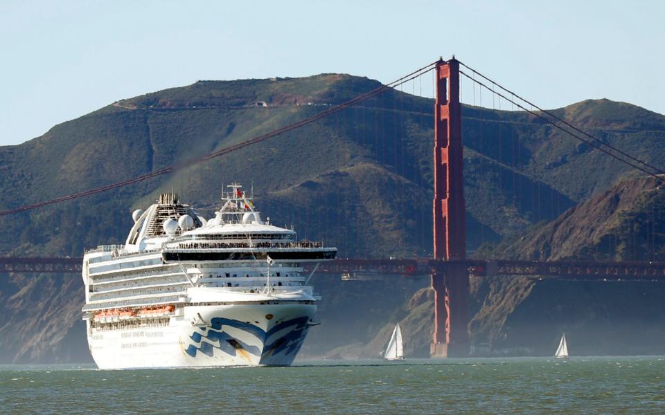 The Grand Princess cruise ship passes the Golden Gate Bridge as it arrives from Hawaii in San Francisco - AP
