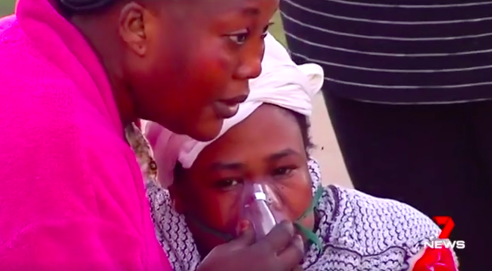 The distraught mother had to be given oxygen after her house went up in flames. Source: 7 News