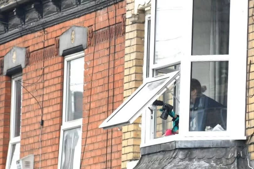 Crime Scene Investigation take photos from the top floor of a house in Park Grove, Hull