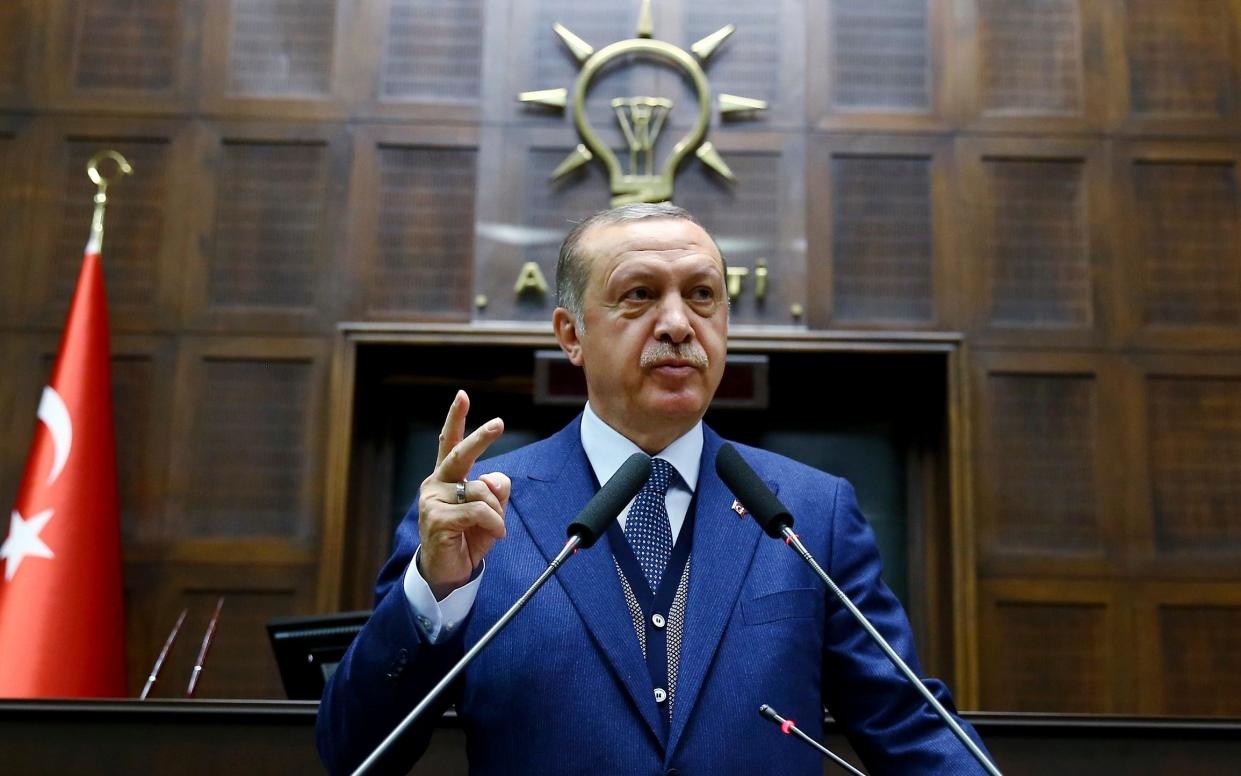 Turkey's President Recep Tayyip Erdogan, gestures as he talks to members of the ruling Justice and Development party  - POOL Presidency Press Service