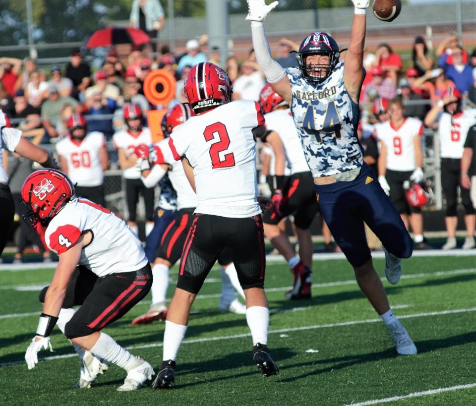 Brady Pretzlaff tries to swat a pass during Gaylord's 37-16 victory over Marquette in the team's third annual Valor Game on Saturday, Sept. 9 in Gaylord, Mich.