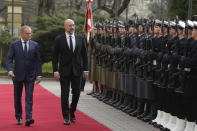 Ukrainian Prime Minister Denys Shmyhal, center, and his Polish counterpart, Prime Minister Donald Tusk, left, review troops during a welcoming ceremony ahead of their talks in Warsaw, Poland, Thursday March 28, 2024. (AP Photo/Czarek Sokolowski)