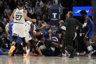 A scrum breaks out between Minnesota Timberwolves and Orlando Magic players during the second half of an NBA basketball game, Friday, Feb. 3, 2023, in Minneapolis. (AP Photo/Abbie Parr)