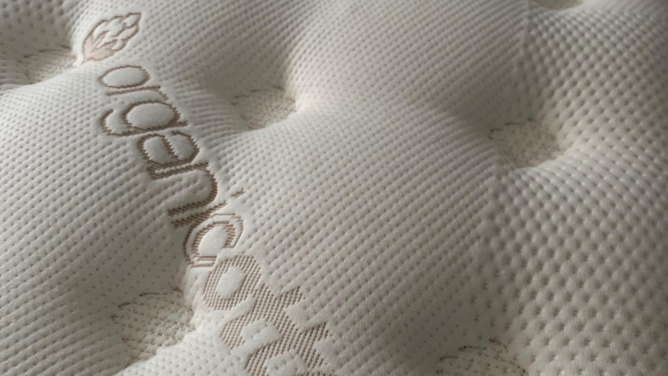 Close up of pillow top cover on Saatva Classic mattress during our review process