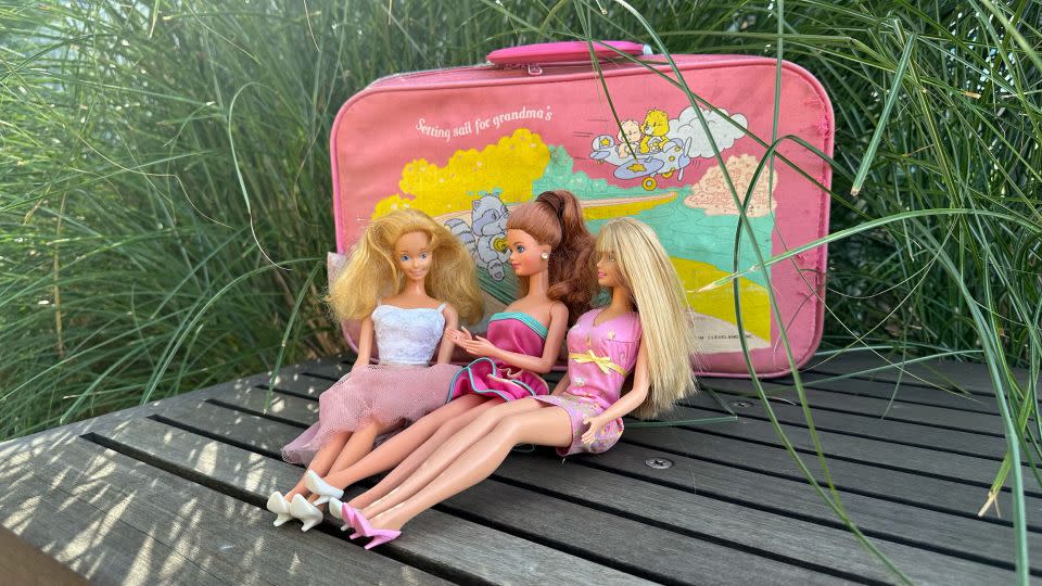 Koelker keeps her Barbie dolls in a Care Bears suitcase. - Courtesy Barbie Koelker