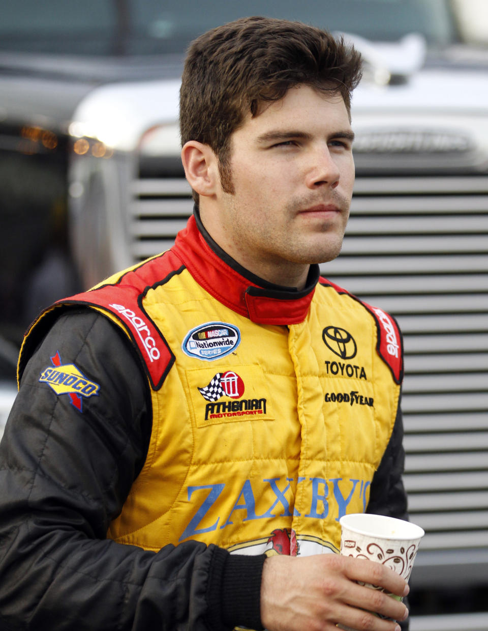 FILE - In this July 4, 2014, file photo, John Wes Townley stands on pit road before a NASCAR Nationwide series auto race at Daytona International Speedway in Daytona Beach, Fla. Former NASCAR driver Townley was killed Saturday, Oct. 2, 2021, in a shooting in Georgia that also wounded a woman, investigators said. Townley, 31, died in the shooting in a neighborhood around 9 p.m., Athens-Clarke County Coroner Sonny Wilson told the Athens Banner-Herald. (AP Photo/Terry Renna, File)