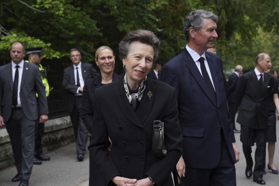 Britain's Princess Anne, Vice Admiral Timothy Laurence, and Zara Tindall join other members of the Royal family on a walkabout to thank members of the public following the death of Queen Elizabeth II on Thursday, at Balmoral, Scotland, Saturday, Sept. 10, 2022. (Owen Humphreys/Pool Photo via AP)