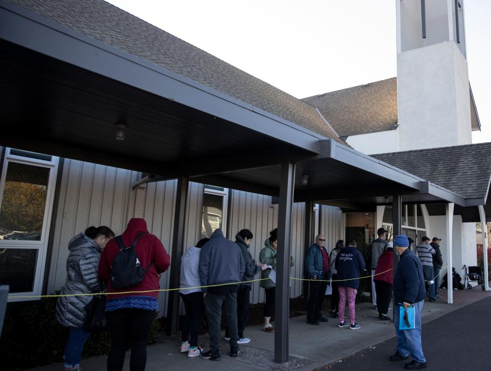 People line up to receive meal boxes during a Marion Polk Food Share a food bank event Nov. 19 at New Harvest Church in Salem.