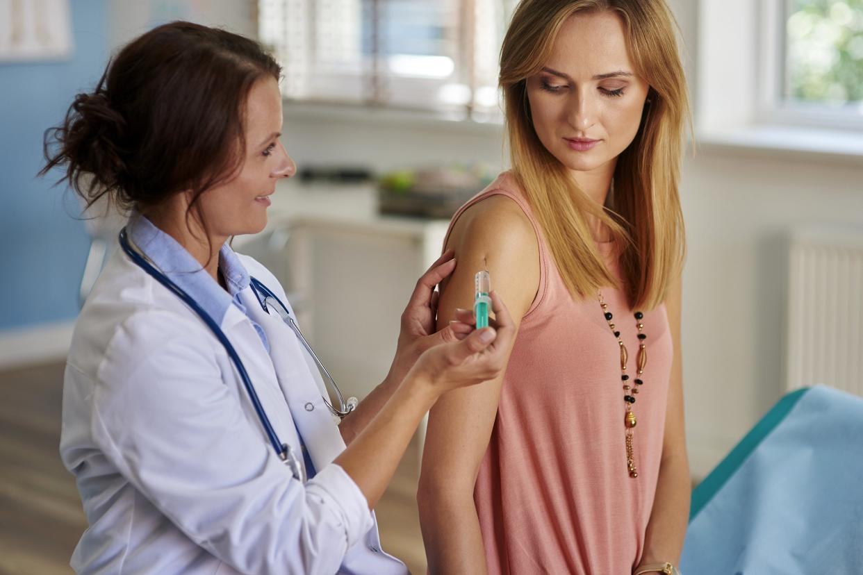 Woman getting an allergy shot at the doctor