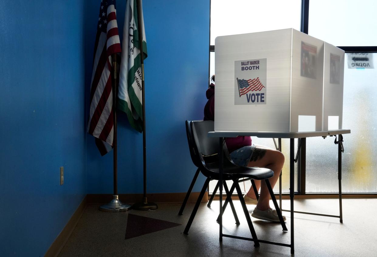 A voters casts her ballots inside the Crooked Alley KidSpace in Groveport on Election Day on Nov. 8.