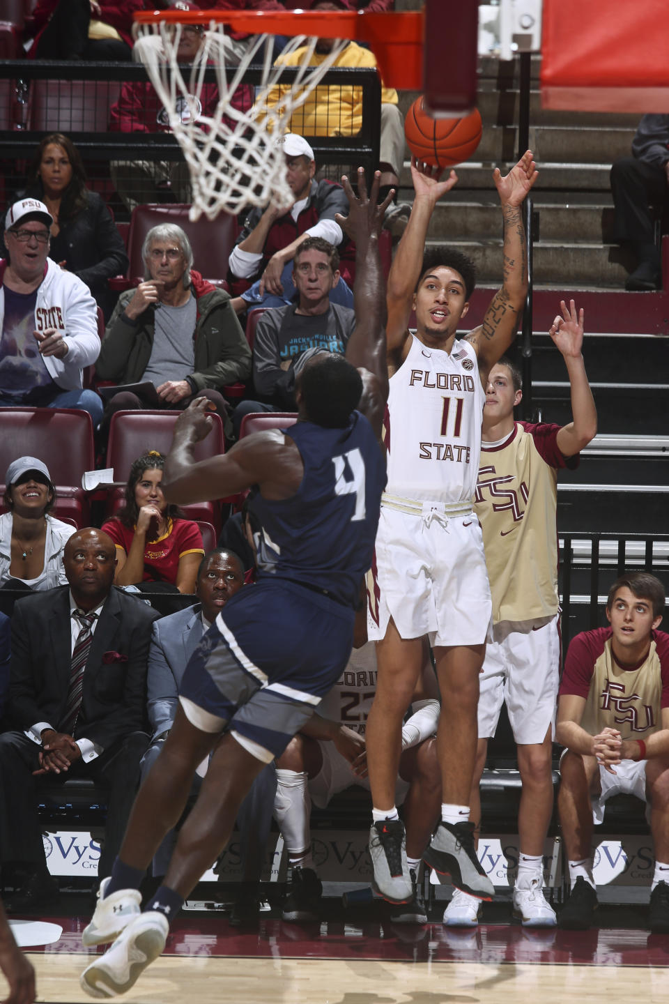 Florida State guard Nathanael Jack (11) shoots a 3-pointer as North Florida forward Ezekiel Balogun (4) defends in the second half of an NCAA college basketball game in Tallahassee, Fla., Tuesday, Dec. 17, 2019. Florida State won 98-81. (AP Photo/Phil Sears)