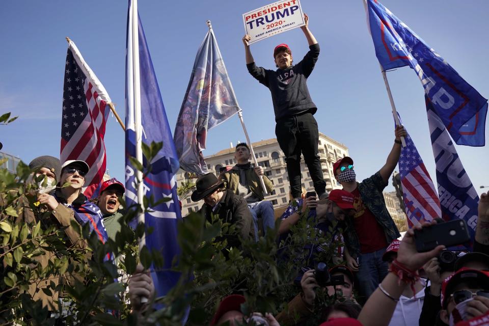 Supporters of President Donald Trump attend a pro-Trump march Saturday Nov. 14, 2020, in Washington. (AP Photo/Jacquelyn Martin)