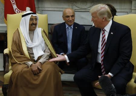 U.S. President Donald Trump (R) welcomes Emir of Kuwait Sabah Al-Ahmad Al-Jaber Al-Sabah (L) in the Oval Office at the White House in Washington, U.S., September 7, 2017. REUTERS/Kevin Lamarque