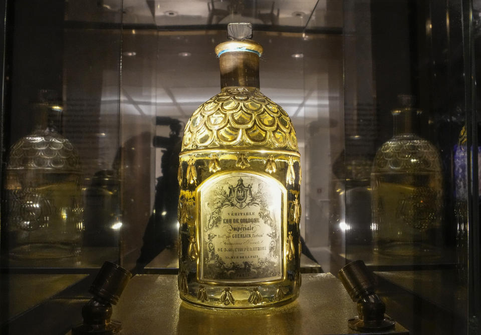 The first Eau de Cologne Imperial Bee bottle imagine by Pierre-Francois Guerlain for Eugenie de Montijo on the occasion of her nuptials with Emperor Napoleon III, is displayed during the exhibition "Chere Eugenie" at Guerlain's boutique of the Champs-Elysees avenue in Paris, Tuesday, May 30, 2023. Guerlain, the house which invented modern perfumery, has for the first time in its history created an archive to delve into its pioneering and history making past. (AP Photo/Michel Euler)