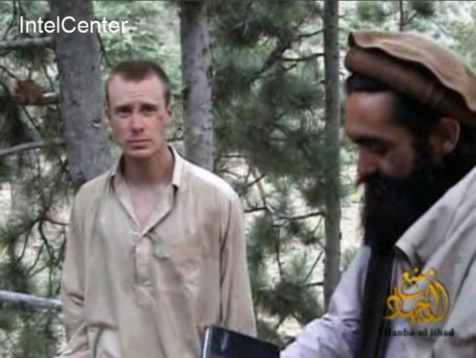 FILE - This file image provided by IntelCenter on Wednesday Dec. 8, 2010 shows a frame grab from a video released by the Taliban containing footage of a man believed to be Sgt. Bowe Bergdahl, left. The nearly five-year effort to free the only American soldier held captive in Afghanistan is scattered among numerous federal agencies with a loosely organized group of people working on it mostly part time, according to two members of Congress and military officials involved in the effort. An ever-shrinking U.S. military presence in Afghanistan has re-focused attention on efforts to bring home Bergdahl, who has been held by the Taliban since June 30, 2009. (AP Photo/IntelCenter, File) MANDATORY CREDIT: INTELCENTER; NO SALES; EDS NOTE: "INTELCENTER" AT LEFT TOP CORNER ADDED BY SOURCE