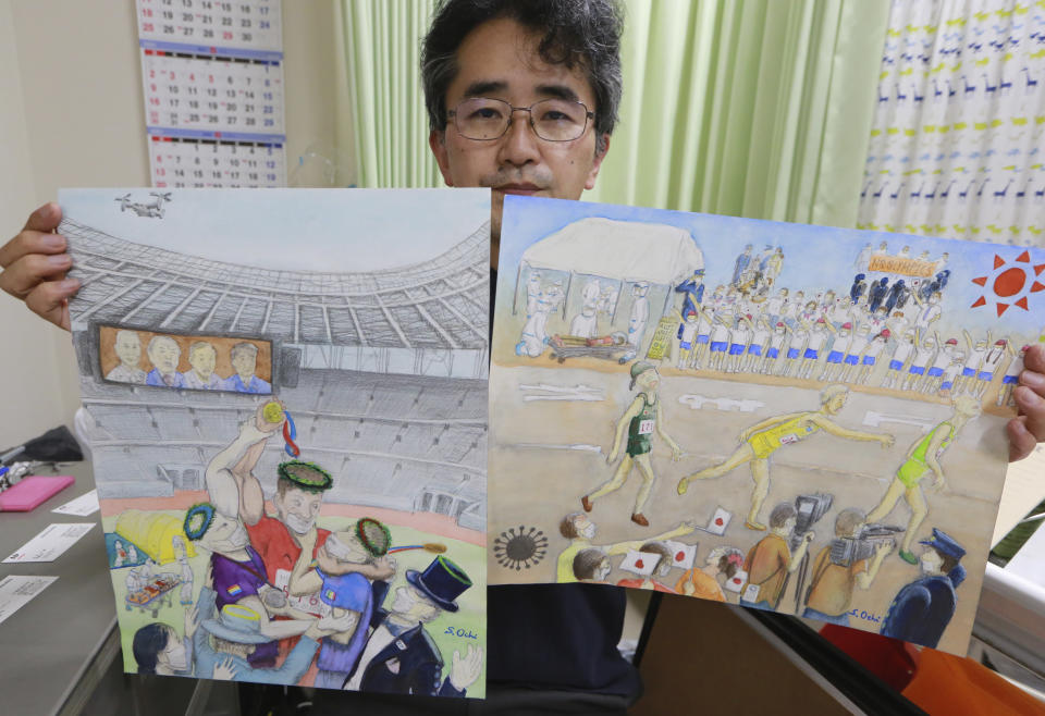 Doctor Sachihiro Ochi holds his work during an interview with the Associated Press in Yokohama near Tokyo, Tuesday, June 15, 2021. Ochi, artist who joined the anti-Olympic exhibition, also social worker and doctor in a clinic near Yokohama Stadium, which will host Olympic baseball and softball games. He says Yokohama and Tokyo, have hardened their policies on the homeless because of the Olympics. Public spaces that were once open are now covered with colored cones and obstacles to keep away the homeless, he said. (AP Photo/Koji Sasahara)