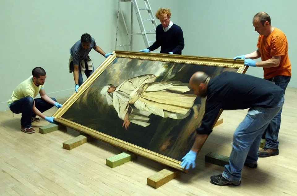 Joshua Reynolds’s ‘Portrait of Omai’ is moved before going on display at Tate Britain in 2005 (PA)