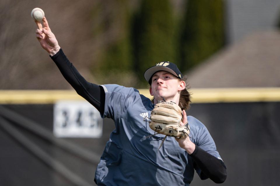 Warren Central High School senior Eli Shaw, an IU commit, plays catch before the team practice Wednesday, March 29, 2023, at their home field in Indianapolis. Warren Central is looking for its a winning season under second-year coach Chris Ulrey. 