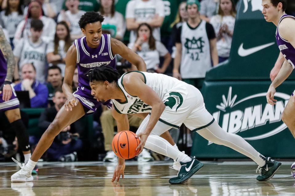 Michigan State guard A.J. Hoggard (11) dribbles against Northwestern guard Blake Smith (43) during the first half at Breslin Center in East Lansing on Wednesday, March 6, 2024.