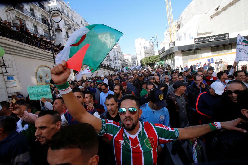 Demonstrators take part in a protest to demand for the presidential election scheduled for next week to be cancelled, in Algiers