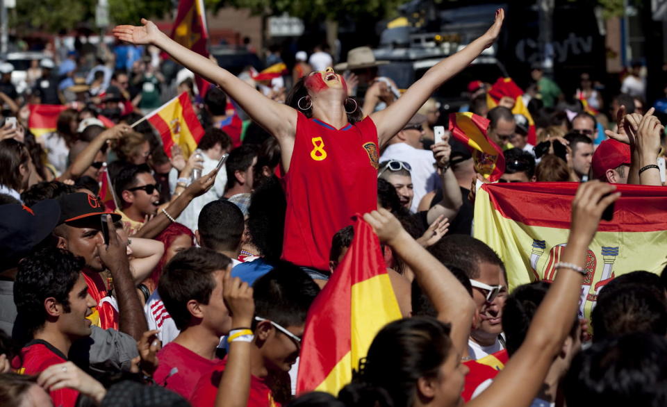 Spain soccer fans celebrate outside The Rochester in Toronto as their team beat Italy in the Euro 2012 soccer championship final in Kiev, Ukraine. Toronto, Sunday, July 1, 2012. THE CANADIAN PRESS/Michelle Siu