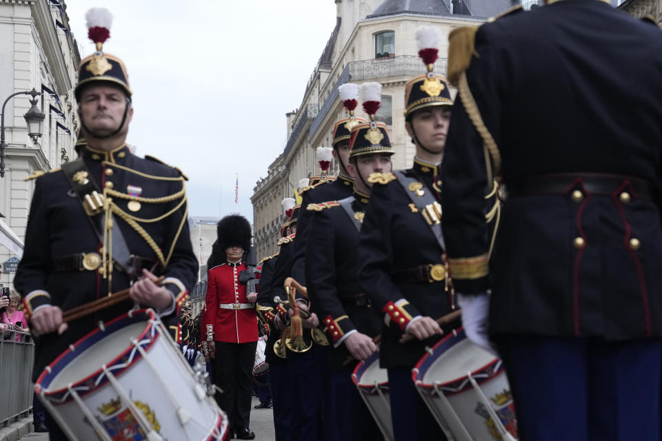 British soldiers and Republican Guards arrive at the Elysee Palace, Monday, April 8, 2024 in Paris. Sixteen soldiers from No 7 Company Coldstream Guards and 32 members of the Gendarmerie Garde Republicaine mount guard at the Elysee palace as British troops join French guards in a special ceremony at the Elysee Palace to celebrate 120 years of "entente cordiale" between the longtime rival powers. (AP Photo/Thibault Camus, Pool)