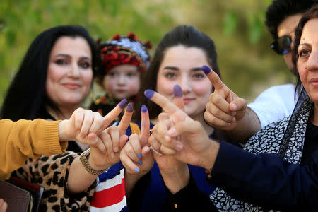 Women show their ink-stained fingers during Kurds independence referendum in Sulaimaniyah, Iraq September 25, 2017. REUTERS/Alaa Al-Marjani