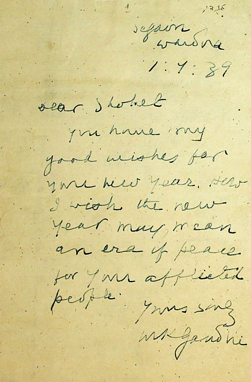 This photo made available by the Abraham Schwadron Collection, National Library of Israel, shows a Jewish New Year greeting written on Sept. 1, 1939 by Mahatma Gandhi to a Jewish official upon the outbreak of World War II. The greeting reads, "Dear Shohet, You have my good wishes for your new year. How I wish the new year may mean an era of peace for your afflicted people. Yours sincerely, MK Gandhi." (Zachary Rothbart/The National Library of Israel via AP)