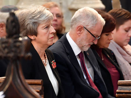 FILE PHOTO: Britain's Prime Minister Theresa May, and the leader of opposition Labour Party, Jeremy Corbyn attend an Armistice remembrance service at St Margaret's Church, in London, Britain November 6, 2018. John Stillwell/Pool via REUTERS/File photo