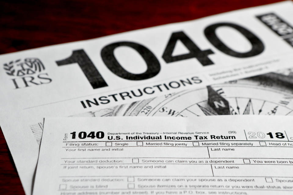 This photo made on Wednesday, Feb. 13, 2019, in Zelienople, Pa., shows mulitiple forms printed from the Internal Revenue Service web page that are used for 2018 U.S. federal tax returns. (AP Photo/Keith Srakocic)