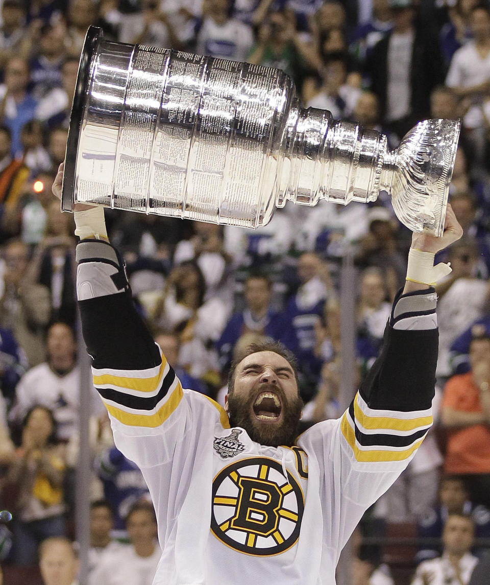 FILE - In this XXX file photo, Boston Bruins defenseman Zdeno Chara hoists the Stanley Cup after the Boston Bruins beat the Vancouver Canucks 4-0 during Game 7 of the NHL hockey Stanley Cup Finals, Wednesday, June 15, 2011, in Vancouver, British Columbia. Longtime Boston Bruins captain Zdeno Chara signed with the Washington Capitals, a stunning move less than a week before most NHL teams open training camp. (AP Photo/Julie Jacobson, File)