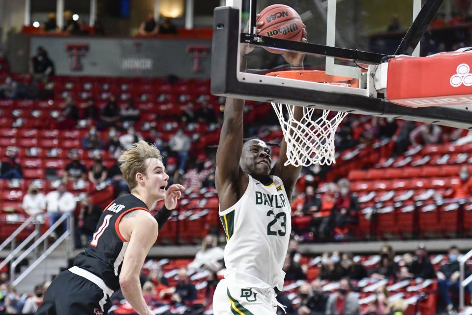 Baylor's Jonathan Tchatchoua (23) dunks the ball during the second half of an NCAA college basketball game against Texas Tech in Lubbock, Texas, Saturday, Jan. 16, 2021. (AP Photo/Justin Rex)