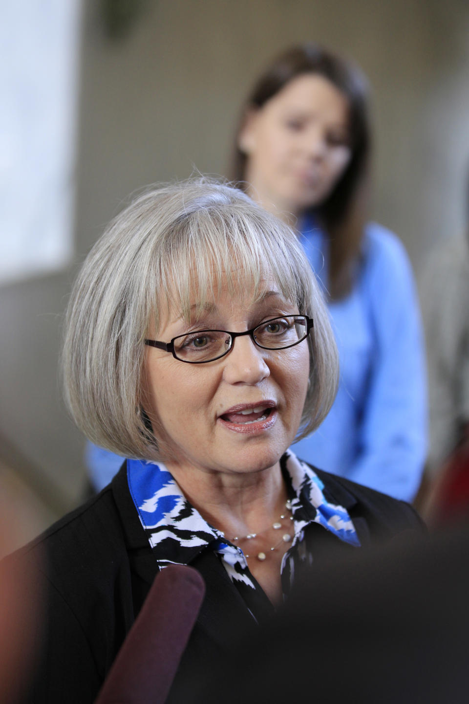 Pharmacist Margo Thelen talks to reporters, Wednesday, Feb. 22, 2012, in Tacoma, Wash., after a federal judge ruled that Washington state may not force pharmacies to sell Plan B or other emergency contraceptives. Thelen, another pharmacist, and an Olympia grocery store sued in 2007, saying that dispensing Plan B would infringe on their religious beliefs because it can prevent the implantation of a fertilized egg. (AP Photo/Ted S. Warren)