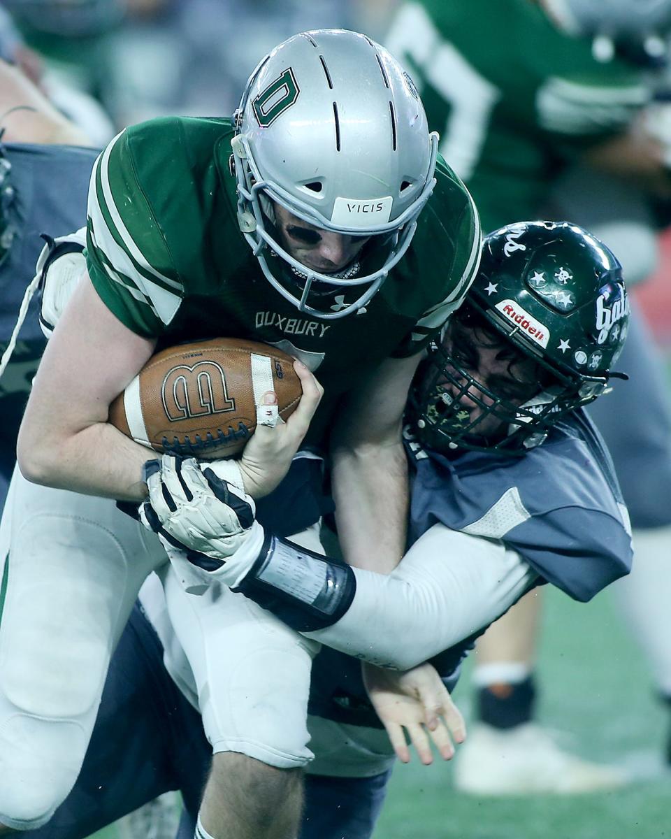 Duxbury's Matthew Festa is tackled by Grafton's Chase Dimond on a quarterback keeper during fourth quarter action of their game against Grafton in the Division 4 Super Bowl at Gillette Stadium in Foxborough on Friday, Dec. 2, 2022. 