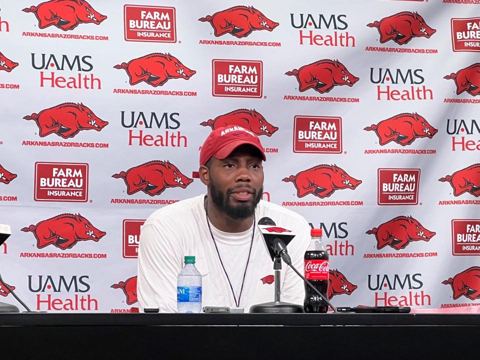 Arkansas football wide receivers coach Kenny Guiton addresses the media after a preseason practice on Aug. 9, 2022.