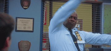 Holt does an air guitar