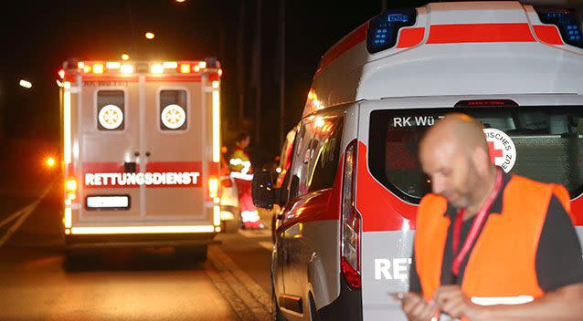 Emergency vehicles at a road block in Wuerzburg after a 17-year-old wielding an axe injured multiple passengers on a regional train. Source: EPA/Karl-Josef Hildenbrand