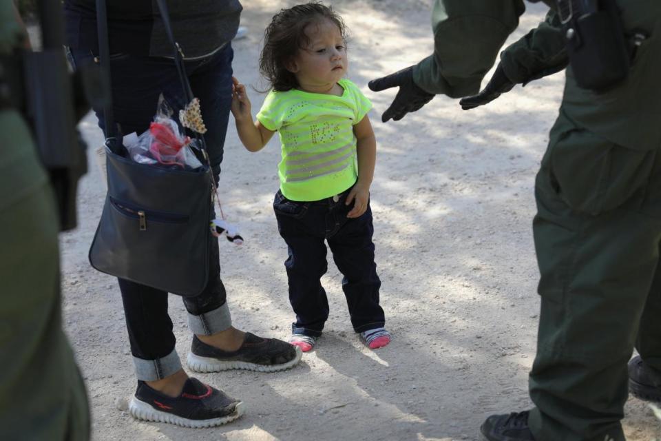 US Border Patrol agents take Central American asylum seekers into custody (Getty Images)